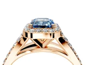 Halo Engagement Ring Setting for Fancy Blue Emerald Cut Center with Narrow Pave Split Shank and Prong Head in Rose Gold
