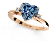3 Stone Engagement Ring Setting for Fancy Blue Heart-Shaped Center with Low-Set Round Cut Accents and Prong Head in Rose Gold