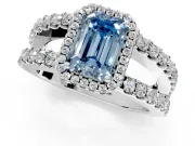 Halo Engagement Ring Setting for Fancy Blue Emerald Cut Center with Wide-Open Pave Split Shank and Prong Head in Platinum