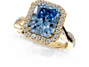 Halo Engagement Ring Setting for Fancy Blue Radiant Cut Center with Twist Band and Prong Head in Yellow Gold