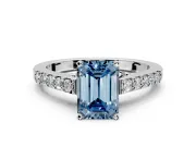 Solitaire Engagement Ring Setting for Fancy Blue Emerald Cut Center with Crossover Accents and Prong Head in Platinum