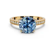 Solitaire Engagement Ring Setting for Fancy Blue Round Cut Center with Channel-Set Accent Band and Prong Head in Yellow Gold