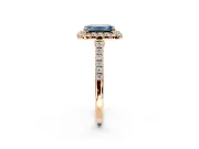 Halo Engagement Ring Setting for Fancy Blue Emerald Cut Center with Narrowing Pave Band and Prong Head in Rose Gold