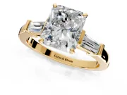 3 Stone Engagement Ring Setting for Radiant Cut Center with Channel Baguette Accents and Prong Head in Yellow Gold