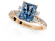 Paired Accent Engagement Ring Setting for Fancy Blue Radiant Cut Center with Pave Band and Prong Head in Rose Gold