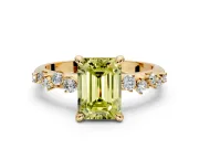 Solitaire Engagement Ring Setting for Fancy Yellow Emerald Cut Center with Trailing Leaf Accent Band and Prong Head in Yellow Gold
