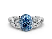 Cluster Engagement Ring Setting for Fancy Blue Oval Center with Round Cut Accent Frame and Prong Head in White Gold