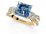 3 Stone Engagement Ring Setting for Fancy Blue Princess Cut Center with Pave Twist Band and Prong Head in Yellow Gold