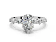 Cluster Engagement Ring Setting for Pear-Shaped Center with Round Cut Accent Band and Prong Head in Platinum