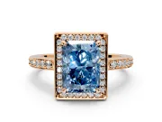 Halo Engagement Ring Setting for Fancy Blue Radiant Cut Center with Metal-Rimmed Halo, Pave Band and Prong Head in Rose Gold