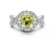Halo Engagement Ring Setting for Fancy Yellow Cushion Cut Center with Pave Infinity Twist Band and Prong Head in White Gold