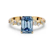 Cluster Engagement Ring Setting for Fancy Blue Emerald Cut Center with Round Cut Accent Band and Prong Head in Yellow Gold