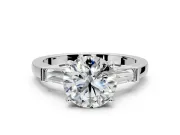 3 Stone Engagement Ring Setting for Round Cut Center with Channel Baguette Accents and Prong Head in Platinum
