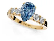5 Stone Engagement Ring Setting for Fancy Blue Pear-Shaped Center with Plain Band and Prong Head in Yellow Gold