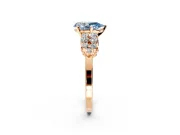 Cluster Engagement Ring Setting for Fancy Blue Pear-Shaped Center with 2-Row Shoulder Clusters and Prong Head in Rose Gold