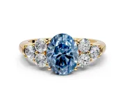 Cluster Engagement Ring Setting for Fancy Blue Oval Center with Round Cut Accent Frame and Prong Head in Yellow Gold
