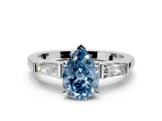 3 Stone Engagement Ring Setting for Fancy Blue Pear-Shaped Center with Tapered Baguettes, Plain Band and Prong Head in Platinum