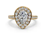 Bezel-Framed Halo Engagement Ring Setting for Pear-Shaped Center with Pave Band and Prong Head in Yellow Gold