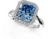 Halo Engagement Ring Setting for Fancy Blue Radiant Cut Center with Twist Band and Prong Head in Platinum