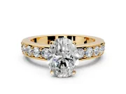 Solitaire Engagement Ring Setting for Oval Center with Channel-Set Accents and Prong Head in Yellow Gold