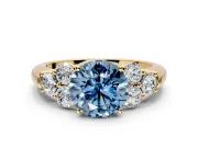 Cluster Engagement Ring Setting for Fancy Blue Round Cut Center with Round Cut Accent Frame and Prong Head in Yellow Gold