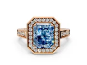 Halo Engagement Ring Setting for Fancy Blue Radiant Cut Center with Outer Bezel Rim, Pave Band and Prong Head in Rose Gold