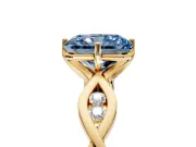 Solitaire Engagement Ring Setting for Fancy Blue Radiant Cut Center with Accented Twist Band and Leaf Prong Head in Yellow Gold