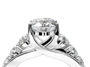 Solitaire Engagement Ring Setting for Oval Center with Graduated Shared Prongs and Prong Head in Platinum