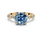 Solitaire Engagement Ring Setting for Fancy Blue Round Cut Center with Trailing Leaf Accent Band and Prong Head in Yellow Gold