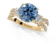 3 Stone Engagement Ring Setting for Fancy Blue Round Cut Center with Pave Twist Band and Prong Head in Yellow Gold