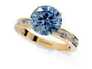 Solitaire Engagement Ring Setting for Fancy Blue Round Cut Center with Channel Baguette Band and Prong Head in Yellow Gold
