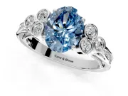 Cluster Engagement Ring Setting for Fancy Blue Oval Center with Bezel Accent Clusters and Prong Head in White Gold