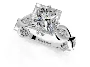 Solitaire Engagement Ring Setting for Princess Cut Center with Accented Twist Band and Leaf Prong Head in Sterling Silver