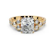 Cluster Engagement Ring Setting for Radiant Cut Center with Bezel Accent Clusters and Prong Head in Yellow Gold