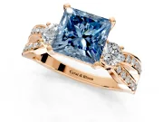 3 Stone Engagement Ring Setting for Fancy Blue Princess Cut Center with Pave Twist Band and Prong Head in Rose Gold