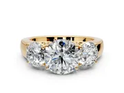 3 Stone Engagement Ring Setting for Round Cut Center with Raised Basket Heads and Prong Head in Yellow Gold