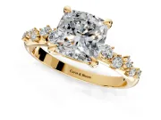 Solitaire Engagement Ring Setting for Cushion Cut Center with Trailing Leaf Accent Band and Prong Head in Yellow Gold