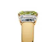 3 Stone Engagement Ring Setting for Fancy Yellow Emerald Cut Center with Raised Basket Heads and Prong Head in Yellow Gold