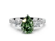 3 Stone Engagement Ring Setting for Fancy Green Pear-Shaped Center with Round Cut Side Accents and Prong Head in Platinum