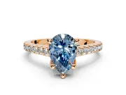 Solitaire Engagement Ring Setting for Fancy Blue Pear-Shaped Center with Widening Pave Band and Claw Prong Head in Rose Gold