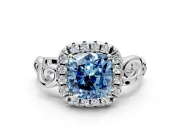 Halo Engagement Ring Setting for Fancy Blue Cushion Cut Center with Open Scroll Shoulders and Prong Head in Platinum