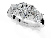 3 Stone Engagement Ring Setting for Heart-Shaped Center with Raised Basket Heads and Prong Head in White Gold
