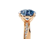 Side Accent Engagement Ring Setting for Fancy Blue Round Cut Center with Accent Shoulders and Prong Head in Rose Gold