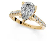 Solitaire Engagement Ring Setting for Pear-Shaped Center with Widening Pave Band and Claw Prong Head in Yellow Gold