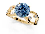 Solitaire Engagement Ring Setting for Fancy Blue Round Cut Center with Criss-Cross Accent Band and Prong Head in Yellow Gold