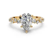 Solitaire Engagement Ring Setting for Pear-Shaped Center with Trailing Leaf Accent Band and Prong Head in Yellow Gold