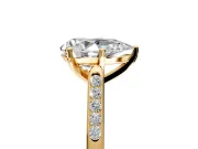 Solitaire Engagement Ring Setting for Pear-Shaped Center with Channel Accents and Prong Head in Yellow Gold