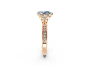 Cluster Engagement Ring Setting for Fancy Blue Pear-Shaped Center with Bezel Accent Clusters and Prong Head in Rose Gold