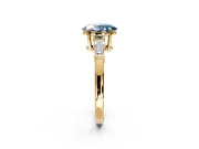 3 Stone Engagement Ring Setting for Fancy Blue Oval Center with Baguette Accents and Prong Head in Yellow Gold