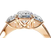 3 Stone Engagement Ring Setting for Radiant Cut Center with Raised Basket Heads and Prong Head in Rose Gold